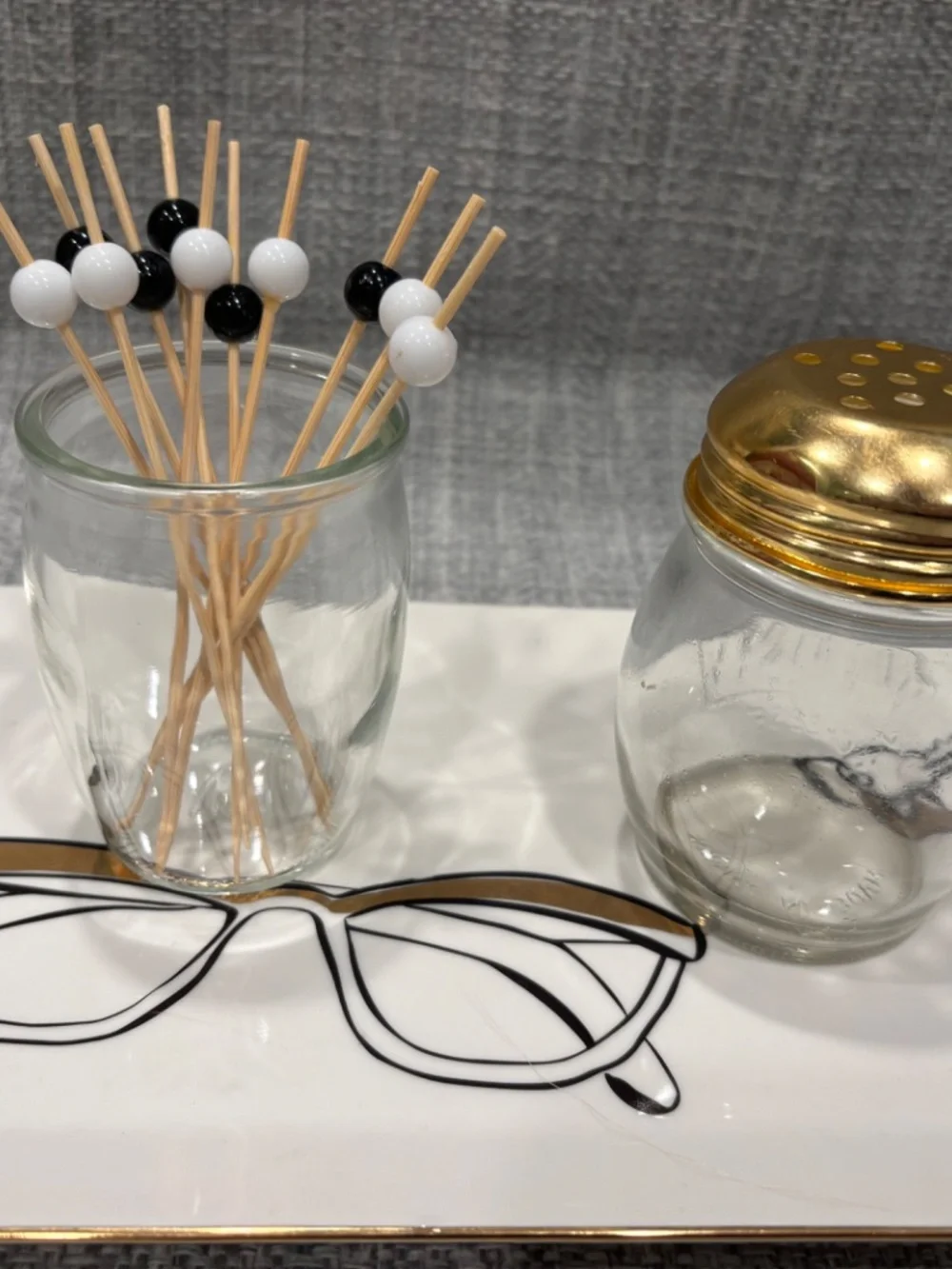 black gold Kate spade tray fine motor transfer lesson by ildewild montessori